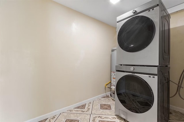 5004 188th St SW, Lynnwood, WA 98037 - washroom featuring stacked washer / drying machine, baseboards, and light tile patterned floors