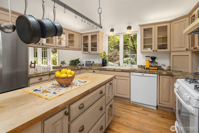 11002 Hyla Ave NE, Bainbridge Island, WA 98110 - kitchen with white appliances, wood counters, a sink, and healthy amount of natural light