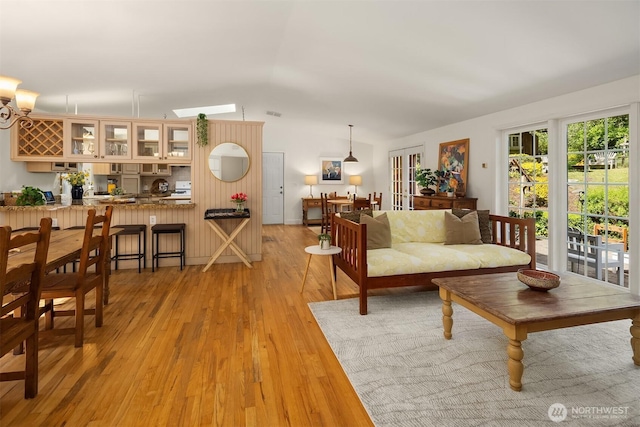 11002 Hyla Ave NE, Bainbridge Island, WA 98110 - living room with vaulted ceiling and light wood-style floors