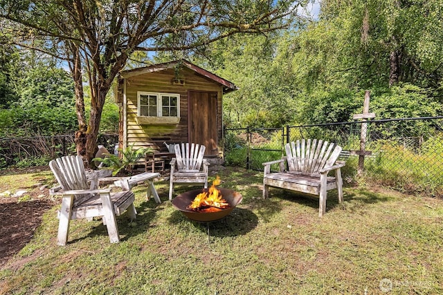 11002 Hyla Ave NE, Bainbridge Island, WA 98110 - view of yard featuring a fire pit and an outbuilding