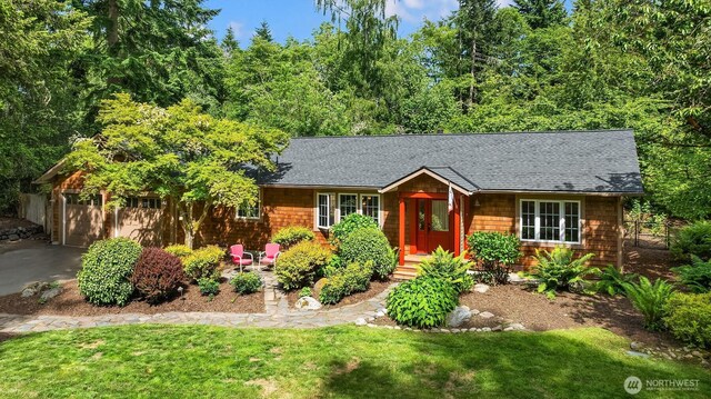 11002 Hyla Ave NE, Bainbridge Island, WA 98110 - view of front of home with a front yard, a shingled roof, a garage, and driveway