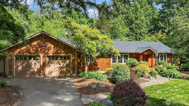 11002 Hyla Ave NE, Bainbridge Island, WA 98110 - view of front of house with asphalt driveway, an attached garage, and roof with shingles