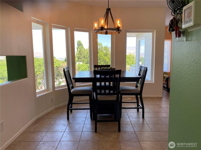 301 Canyon Pl, Wenatchee, WA 98801 - dining area with a chandelier, baseboards, and light tile patterned floors