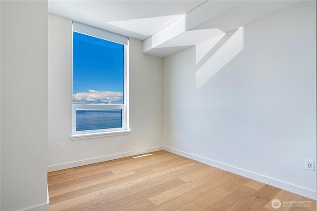 121 Stewart St Unit 2507, Seattle, WA 98101 - empty room with light wood-type flooring and baseboards