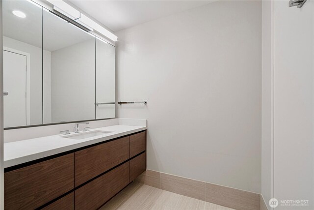 121 Stewart St Unit 2507, Seattle, WA 98101 - bathroom featuring vanity and baseboards