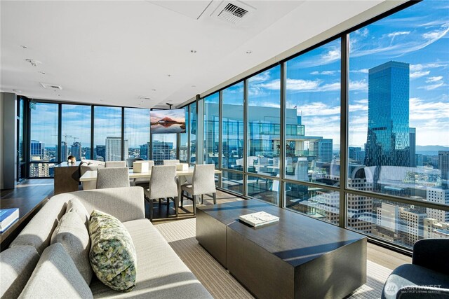 121 Stewart St Unit 2507, Seattle, WA 98101 - living area with a view of skyline and floor to ceiling windows