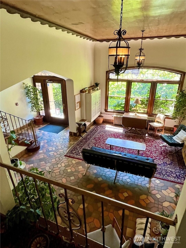 220 W Olympic Pl Unit 309, Seattle, WA 98119 - interior space with plenty of natural light, arched walkways, and a chandelier