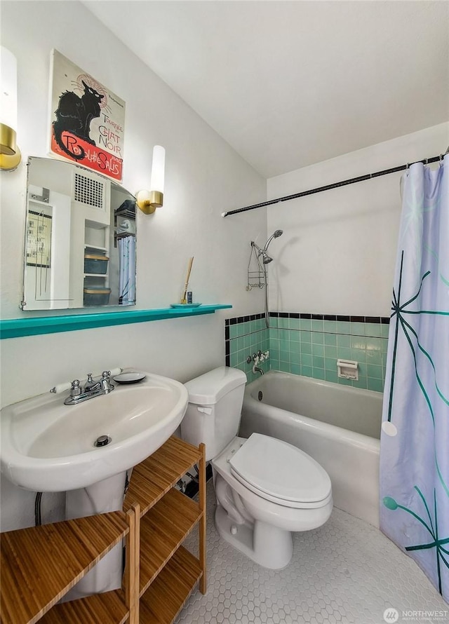 220 W Olympic Pl Unit 309, Seattle, WA 98119 - full bathroom featuring shower / bath combo, toilet, vanity, and tile patterned floors