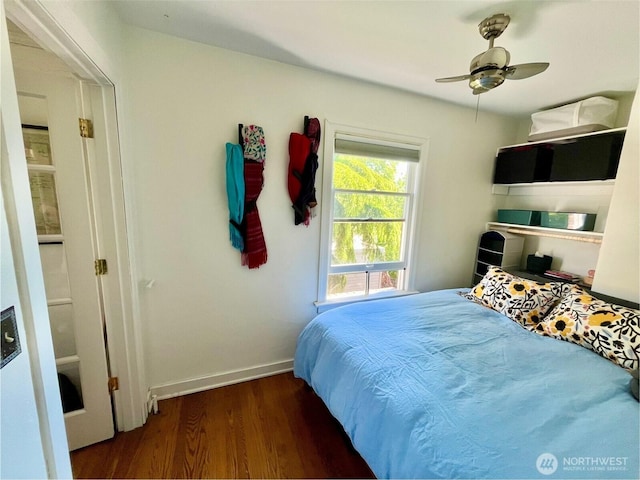 220 W Olympic Pl Unit 309, Seattle, WA 98119 - bedroom featuring wood finished floors and baseboards