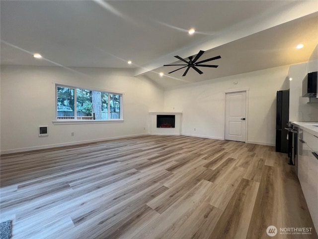 3711 Grandview Dr W, University Place, WA 98465 - unfurnished living room featuring lofted ceiling, light wood-style floors, ceiling fan, a fireplace, and baseboards