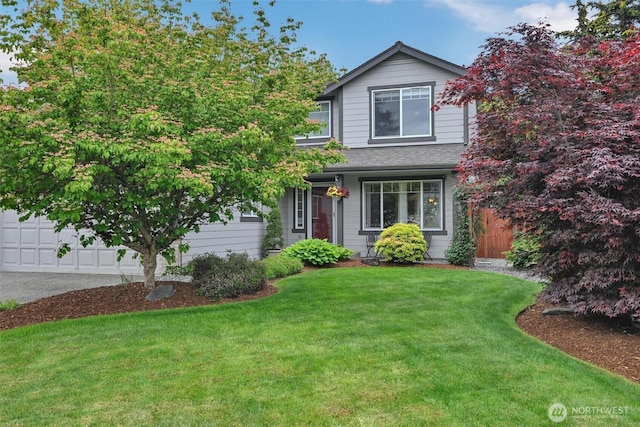 24213 41st Ave E, Spanaway, WA 98387 - traditional-style home featuring a front yard, roof with shingles, and concrete driveway