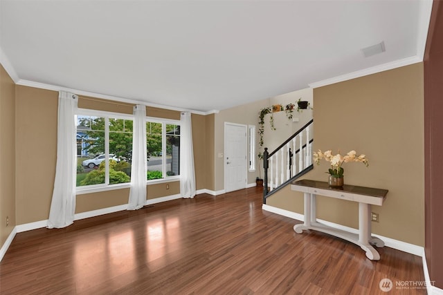 24213 41st Ave E, Spanaway, WA 98387 - foyer featuring stairway, wood finished floors, baseboards, and crown molding