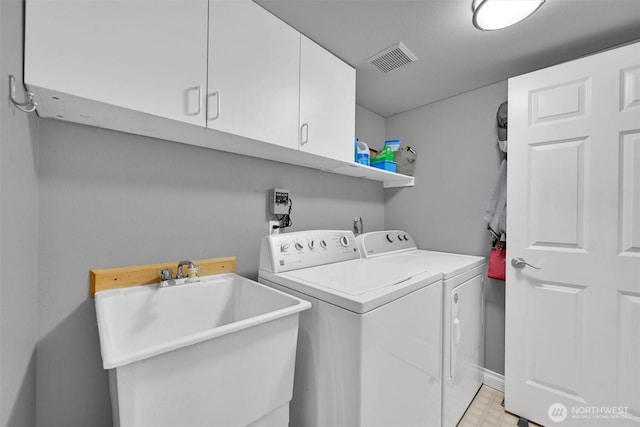 24213 41st Ave E, Spanaway, WA 98387 - laundry area featuring separate washer and dryer and cabinet space