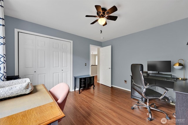 24213 41st Ave E, Spanaway, WA 98387 - home office featuring a ceiling fan, wood finished floors, and baseboards