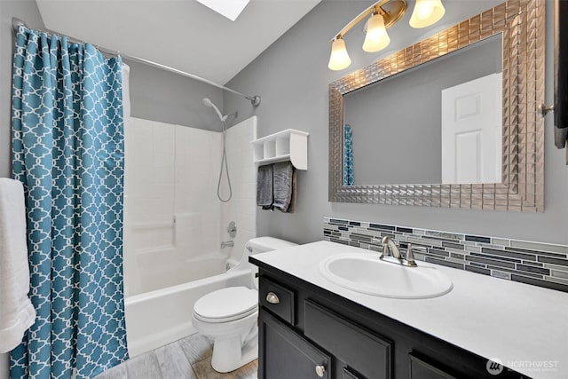 24213 41st Ave E, Spanaway, WA 98387 - full bathroom featuring vanity, shower / bath combination with curtain, toilet, tasteful backsplash, and wood finished floors
