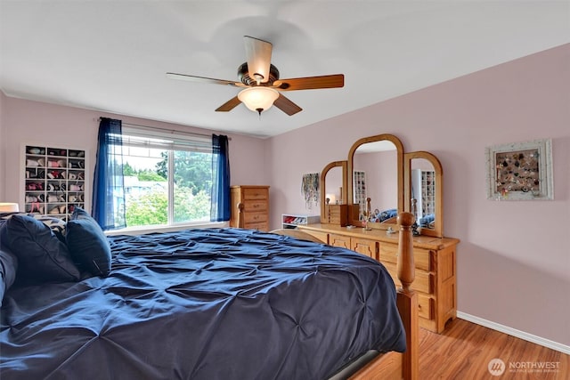 24213 41st Ave E, Spanaway, WA 98387 - bedroom with light wood-type flooring, baseboards, and a ceiling fan