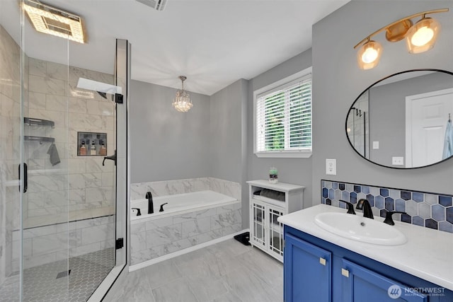 24213 41st Ave E, Spanaway, WA 98387 - bathroom with a bath, marble finish flooring, vanity, a shower stall, and decorative backsplash