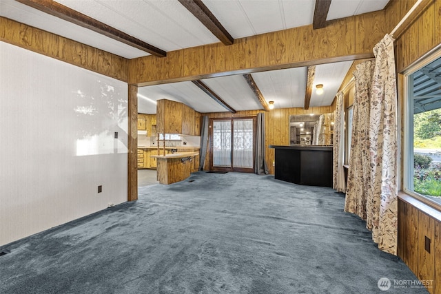 7300 32nd Ave NE Unit 5, Olympia, WA 98516 - unfurnished living room featuring carpet flooring and wooden walls