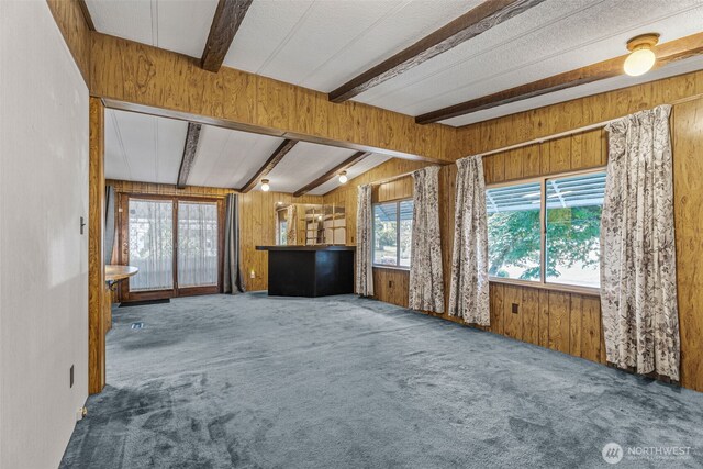7300 32nd Ave NE Unit 5, Olympia, WA 98516 - unfurnished living room with carpet and wooden walls