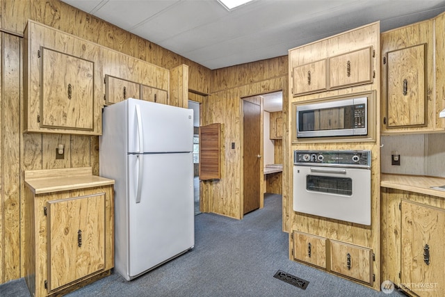 7300 32nd Ave NE Unit 5, Olympia, WA 98516 - kitchen featuring white appliances, wooden walls, carpet, and light countertops