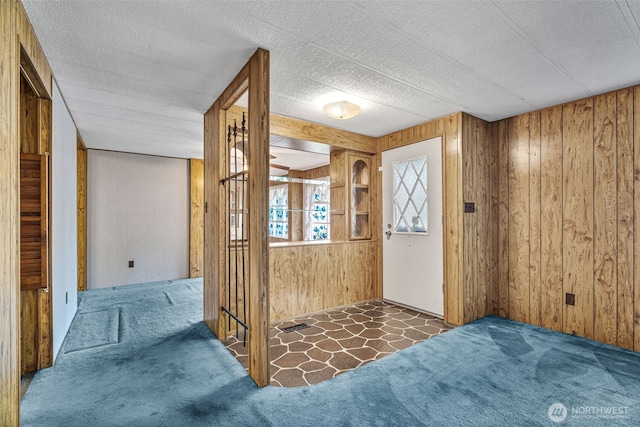 7300 32nd Ave NE Unit 5, Olympia, WA 98516 - carpeted entrance foyer with wood walls
