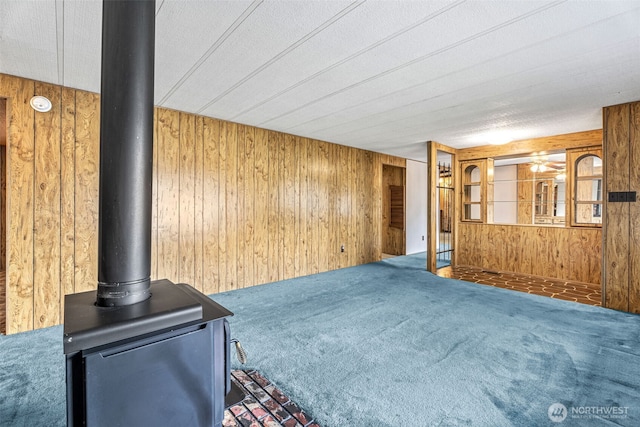 7300 32nd Ave NE Unit 5, Olympia, WA 98516 - living room featuring wood walls and carpet floors