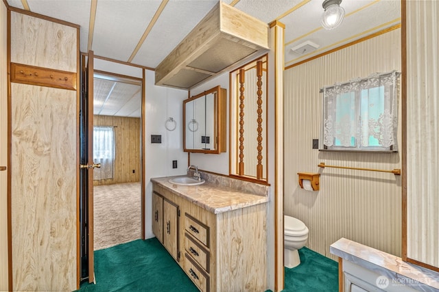 7300 32nd Ave NE Unit 5, Olympia, WA 98516 - bathroom with vanity, toilet, and a textured ceiling
