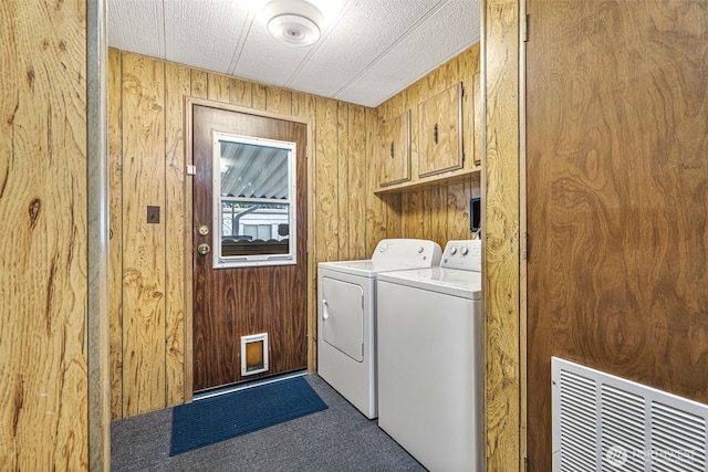 7300 32nd Ave NE Unit 5, Olympia, WA 98516 - washroom with cabinet space, wooden walls, carpet, and separate washer and dryer