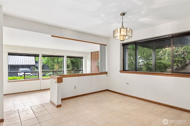 5019 E Mercer Way, Mercer Island, WA 98040 - spare room featuring a chandelier, baseboards, and light tile patterned flooring