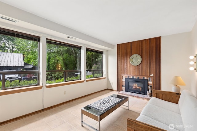 5019 E Mercer Way, Mercer Island, WA 98040 - living room featuring a fireplace, light tile patterned flooring, and baseboards