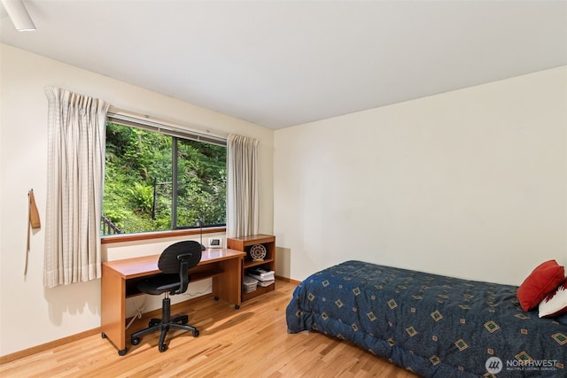 5019 E Mercer Way, Mercer Island, WA 98040 - bedroom featuring wood finished floors, baseboards, and a desk