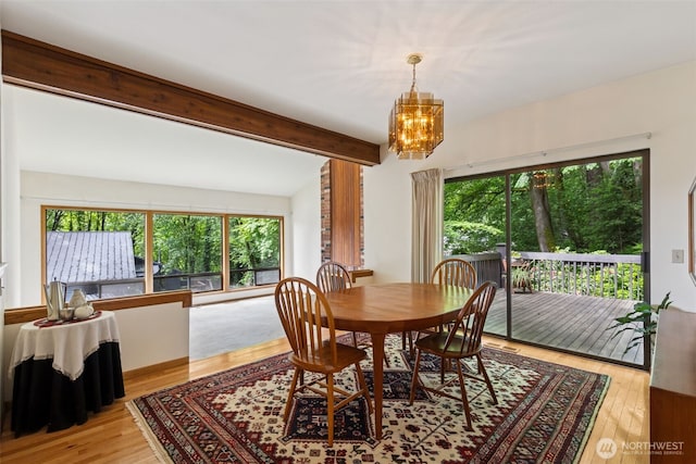 5019 E Mercer Way, Mercer Island, WA 98040 - dining space with plenty of natural light, a chandelier, beamed ceiling, and light wood-style flooring