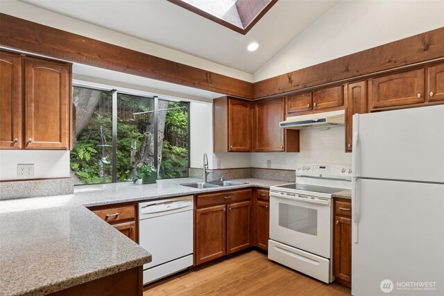 5019 E Mercer Way, Mercer Island, WA 98040 - kitchen featuring white appliances, under cabinet range hood, a sink, a skylight, and vaulted ceiling