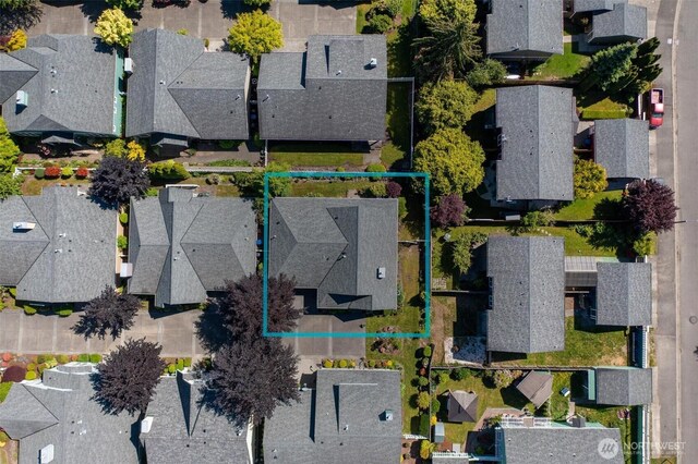 221 NE Honey Locust Ct, Poulsbo, WA 98370 - aerial perspective of suburban area featuring property parcel outlined