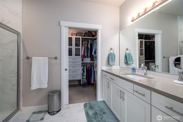 742 Parkland Loop, Sedro Woolley, WA 98284 - bathroom with marble look tile flooring, vanity, and a spacious closet