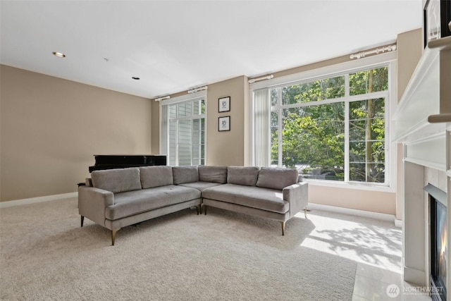 11800 SE 4th Pl Unit 203, Bellevue, WA 98005 - carpeted living room with a high end fireplace and baseboards