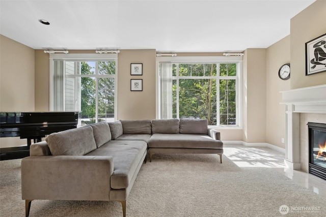 11800 SE 4th Pl Unit 203, Bellevue, WA 98005 - carpeted living room with a tiled fireplace and baseboards