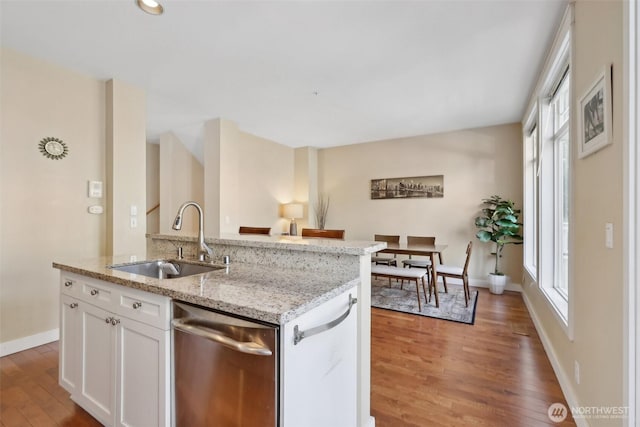 11800 SE 4th Pl Unit 203, Bellevue, WA 98005 - kitchen with dishwasher, a sink, light wood finished floors, and plenty of natural light