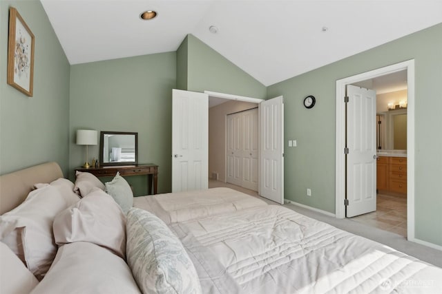 11800 SE 4th Pl Unit 203, Bellevue, WA 98005 - bedroom featuring vaulted ceiling, baseboards, light colored carpet, connected bathroom, and a closet