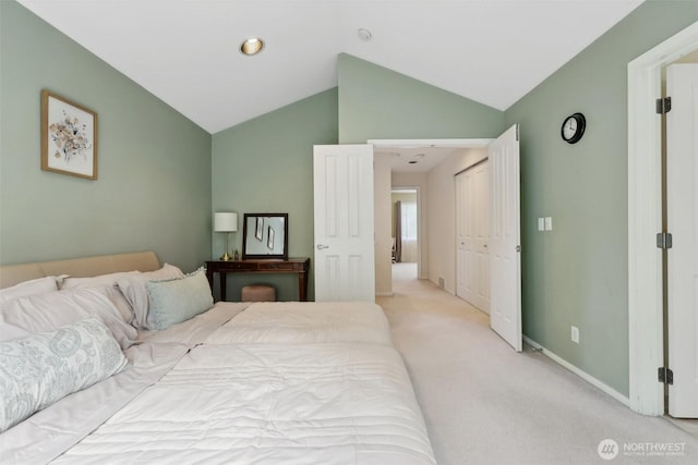 11800 SE 4th Pl Unit 203, Bellevue, WA 98005 - bedroom with lofted ceiling, baseboards, and light carpet