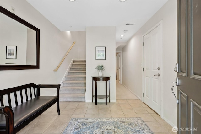 11800 SE 4th Pl Unit 203, Bellevue, WA 98005 - foyer with stairway, light tile patterned floors, recessed lighting, and baseboards