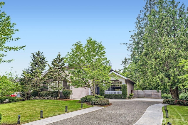 3402 174th Pl SE, Bothell, WA 98012 - view of property hidden behind natural elements featuring driveway and a garage