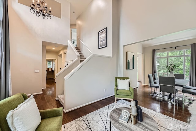 3402 174th Pl SE, Bothell, WA 98012 - living room featuring a towering ceiling, healthy amount of natural light, a chandelier, wood finished floors, and stairway