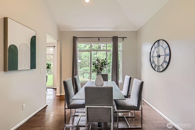 3402 174th Pl SE, Bothell, WA 98012 - dining room featuring lofted ceiling, dark wood-type flooring, and baseboards