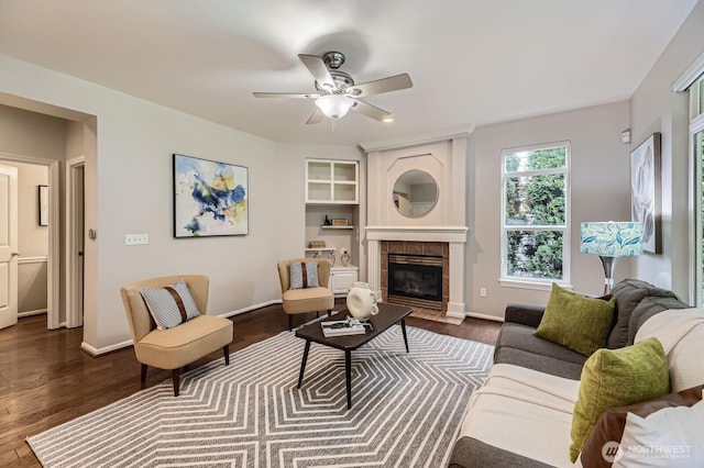 3402 174th Pl SE, Bothell, WA 98012 - living area featuring dark wood-style flooring, a fireplace, ceiling fan, and baseboards