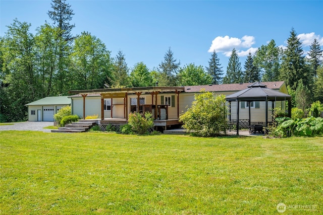 20800 Hartry Ln, Sedro Woolley, WA 98284 - view of front of home with a gazebo, a front lawn, an outdoor structure, and a garage