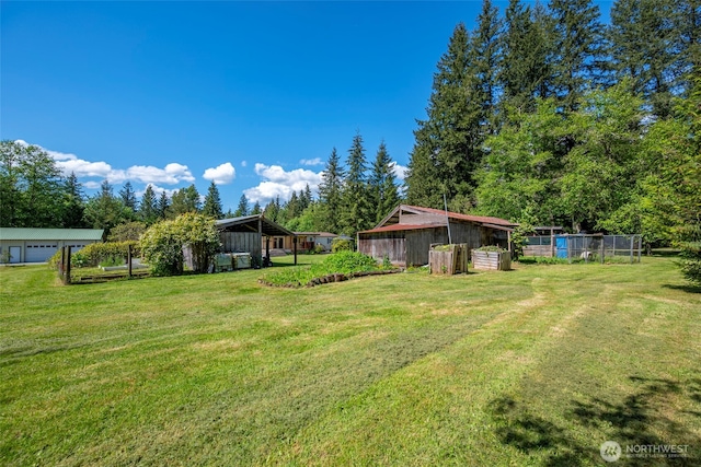 20800 Hartry Ln, Sedro Woolley, WA 98284 - view of yard featuring an outdoor structure and a garage