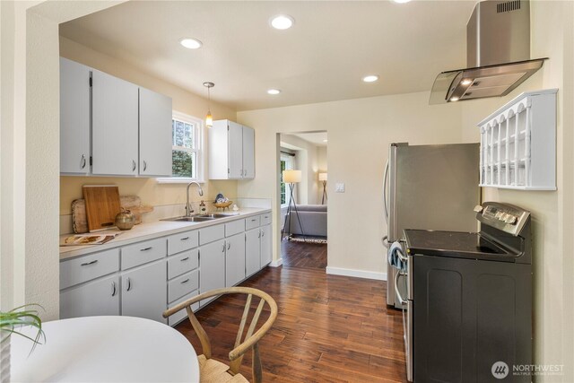 1220 SW Orchard St, Seattle, WA 98106 - kitchen featuring island range hood, a sink, dark wood-type flooring, washer / clothes dryer, and recessed lighting