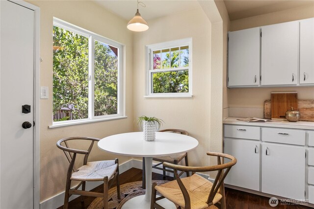 1220 SW Orchard St, Seattle, WA 98106 - dining area with dark wood finished floors