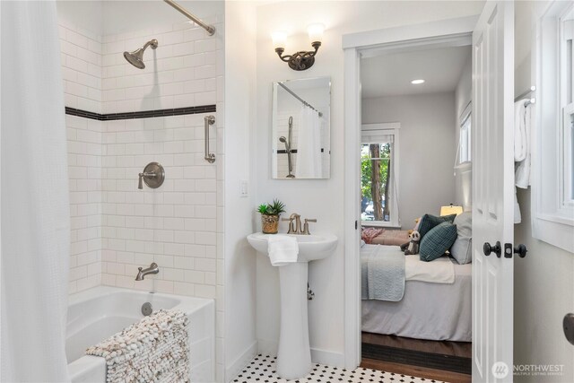 1220 SW Orchard St, Seattle, WA 98106 - ensuite bathroom featuring shower / bathtub combination with curtain, baseboards, and a sink